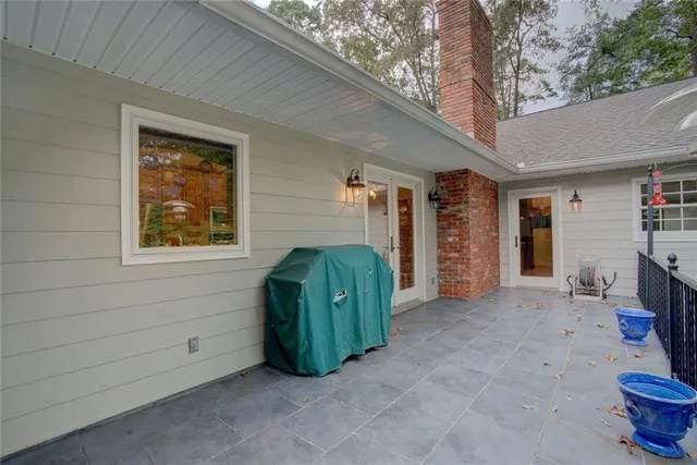 a bedroom with furniture and a wooden floor