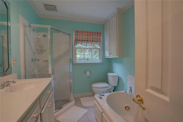 a living room with furniture and a dining table with wooden floor