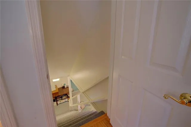 a bathroom with a glass shower door and a sink