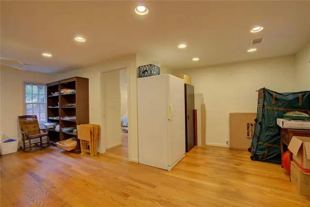 a view of a patio with table and chairs
