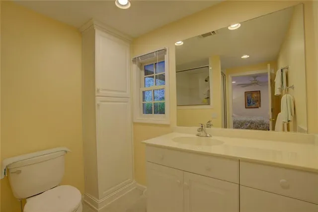 an aerial view of a house with a yard basket ball court and outdoor seating