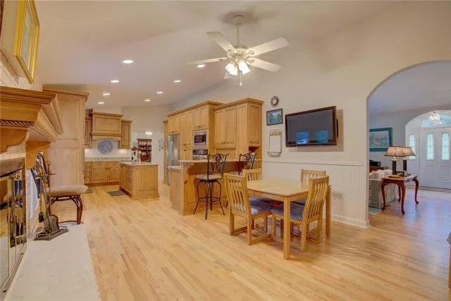 a kitchen with a stove a sink and a refrigerator