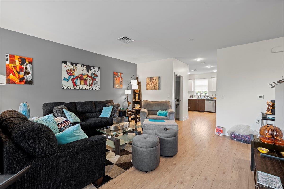 710 Main Street Peekskill, NY 10566 - Photo 6 of 26 a living room with furniture and a wooden floor