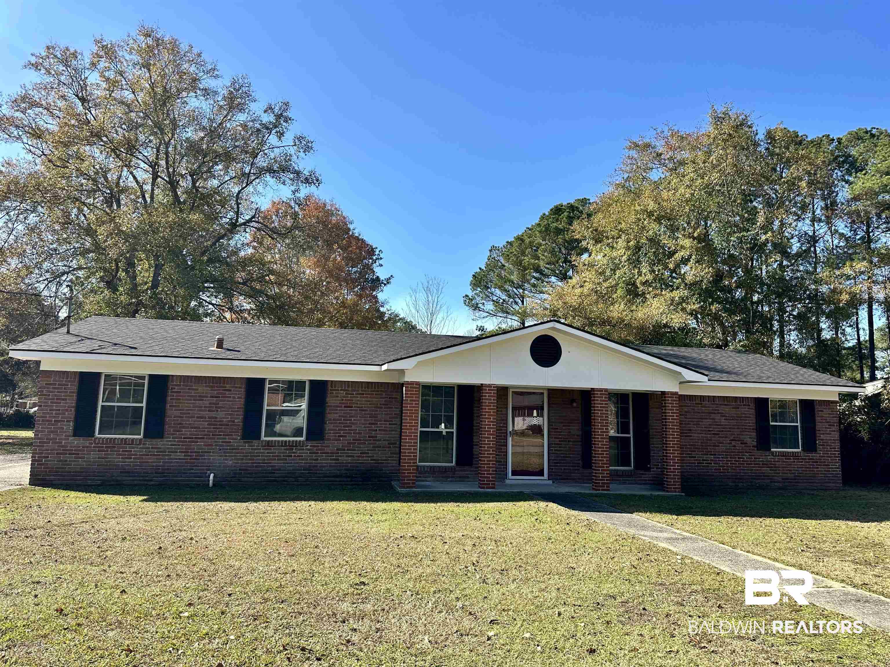 103 Avalon Street Brewton, AL 36426 - Photo 1 of 14 Ranch-style house with a front yard