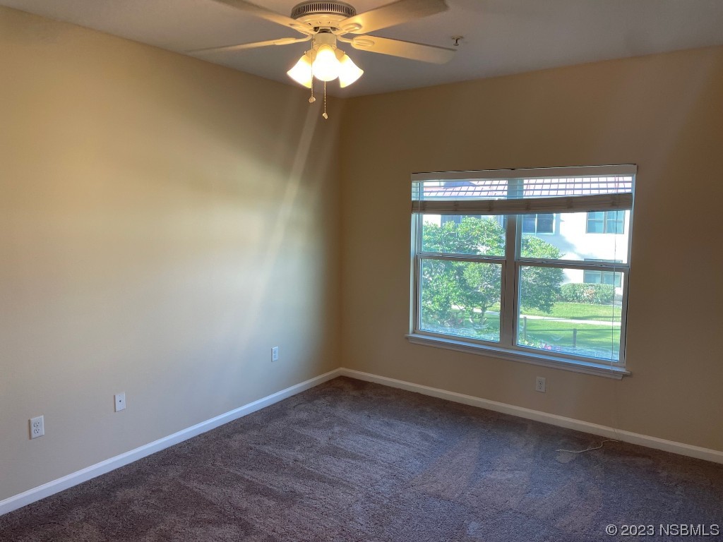 Undisclosed Address New Smyrna Beach, FL 32169 - Photo 11 of 22 an empty room with a window and a fan