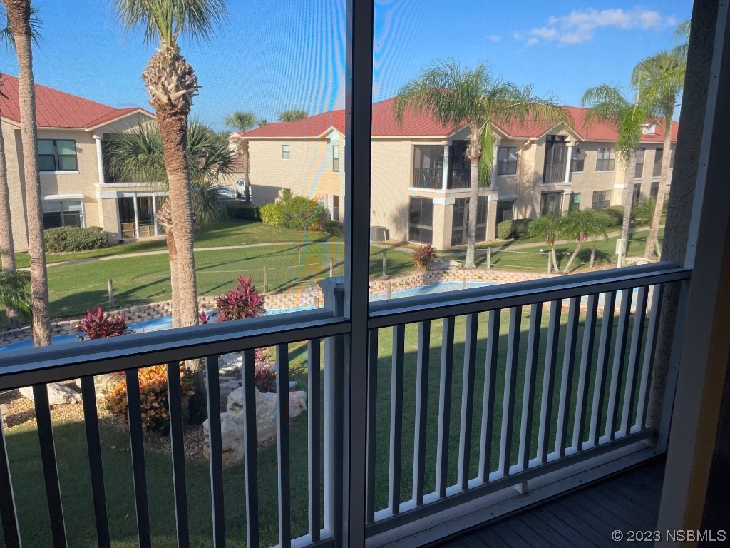 Undisclosed Address New Smyrna Beach, FL 32169 - Photo 15 of 22 a view of a street from a balcony