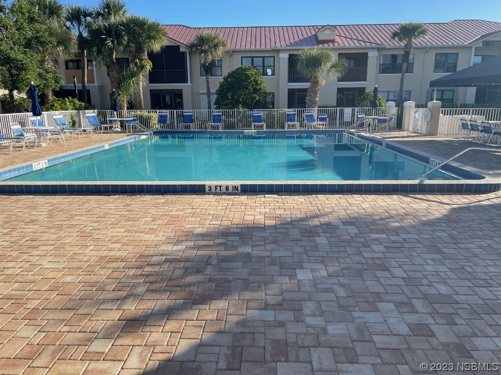 Undisclosed Address New Smyrna Beach, FL 32169 - Photo 18 of 22 a view of swimming pool with outdoor seating and plants