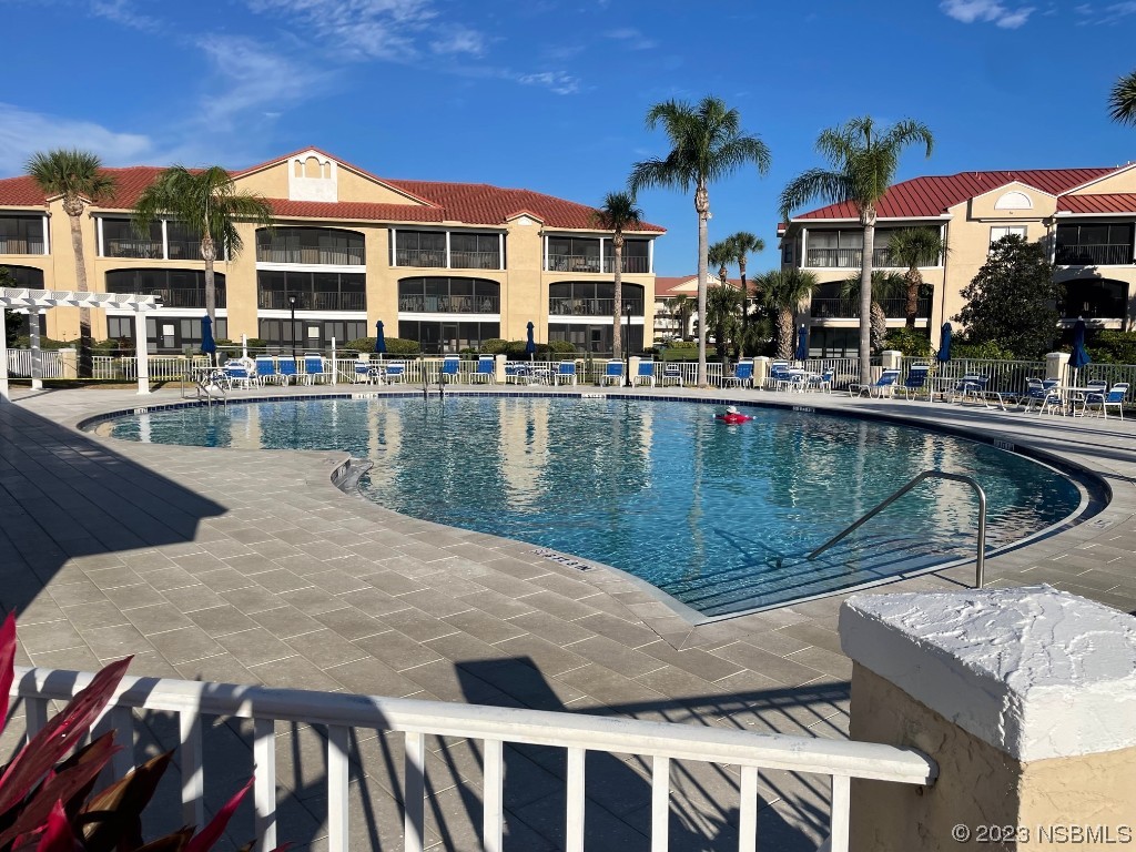Undisclosed Address New Smyrna Beach, FL 32169 - Photo 20 of 22 a view of a patio with swimming pool table and chairs