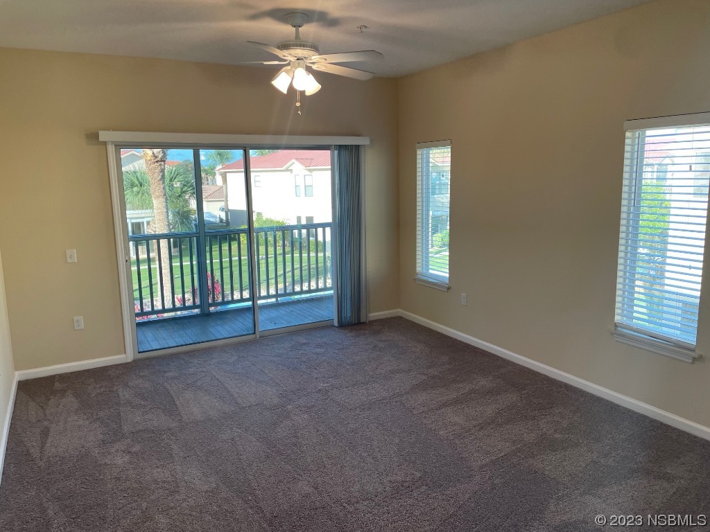 Undisclosed Address New Smyrna Beach, FL 32169 - Photo 6 of 22 a view of a livingroom with a ceiling fan and window