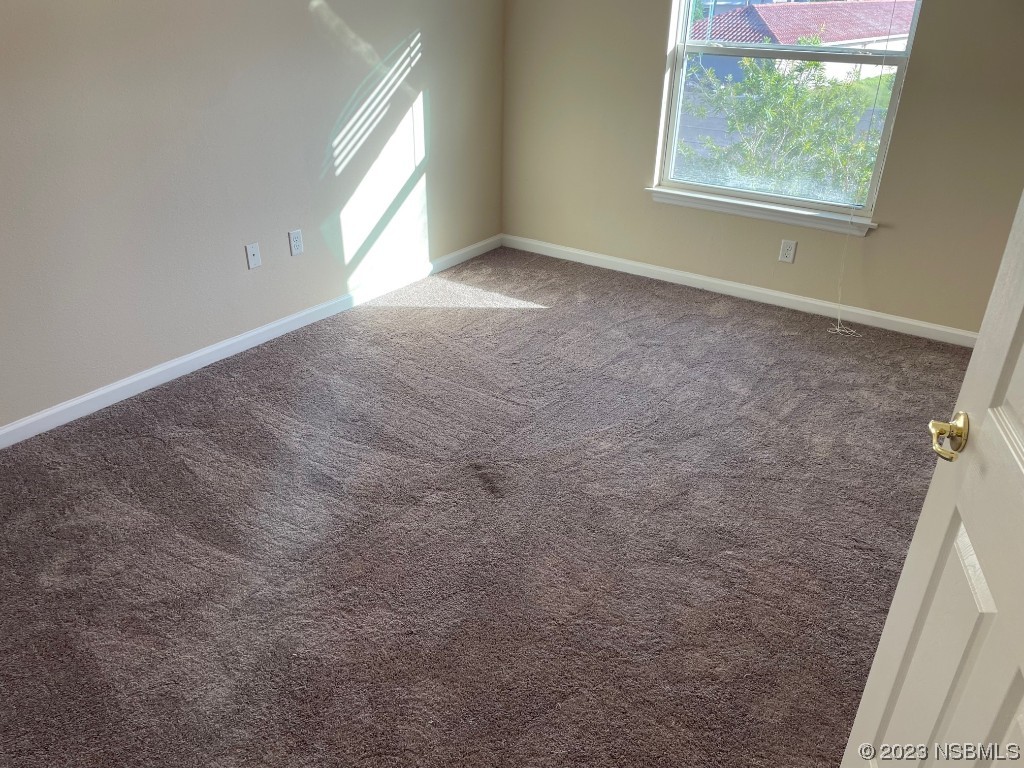 Undisclosed Address New Smyrna Beach, FL 32169 - Photo 8 of 22 a view of an empty room with a window