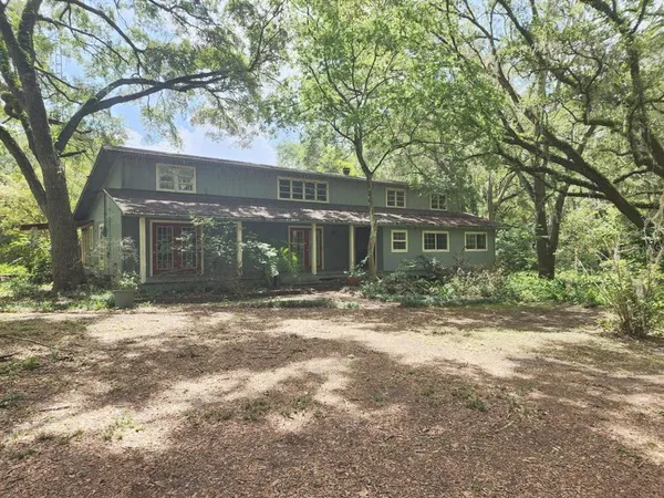 front view of a house with a trees
