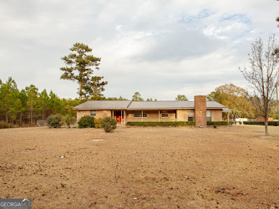 5209 Highway 32 Patterson, GA 31557 - Photo 1 of 45 a view of a house with a snow in front of yard