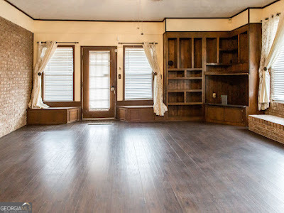 5209 Highway 32 Patterson, GA 31557 - Photo 11 of 45 an empty room with wooden floor and windows