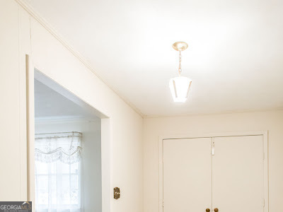 5209 Highway 32 Patterson, GA 31557 - Photo 14 of 45 a view of a hallway with closet and a potted plant