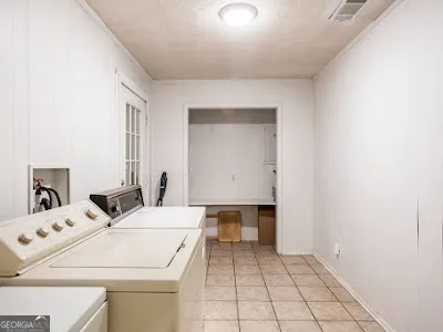 a room with a sink and a mirror