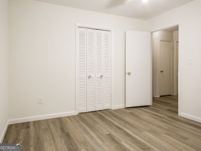 5209 Highway 32 Patterson, GA 31557 - Photo 26 of 45 an empty room with wooden floor & closet area
