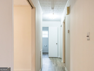 5209 Highway 32 Patterson, GA 31557 - Photo 32 of 45 a view of a hallway with wooden floor