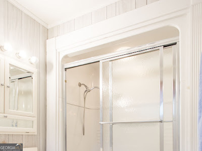 5209 Highway 32 Patterson, GA 31557 - Photo 36 of 45 a bathroom with a glass shower door and a window