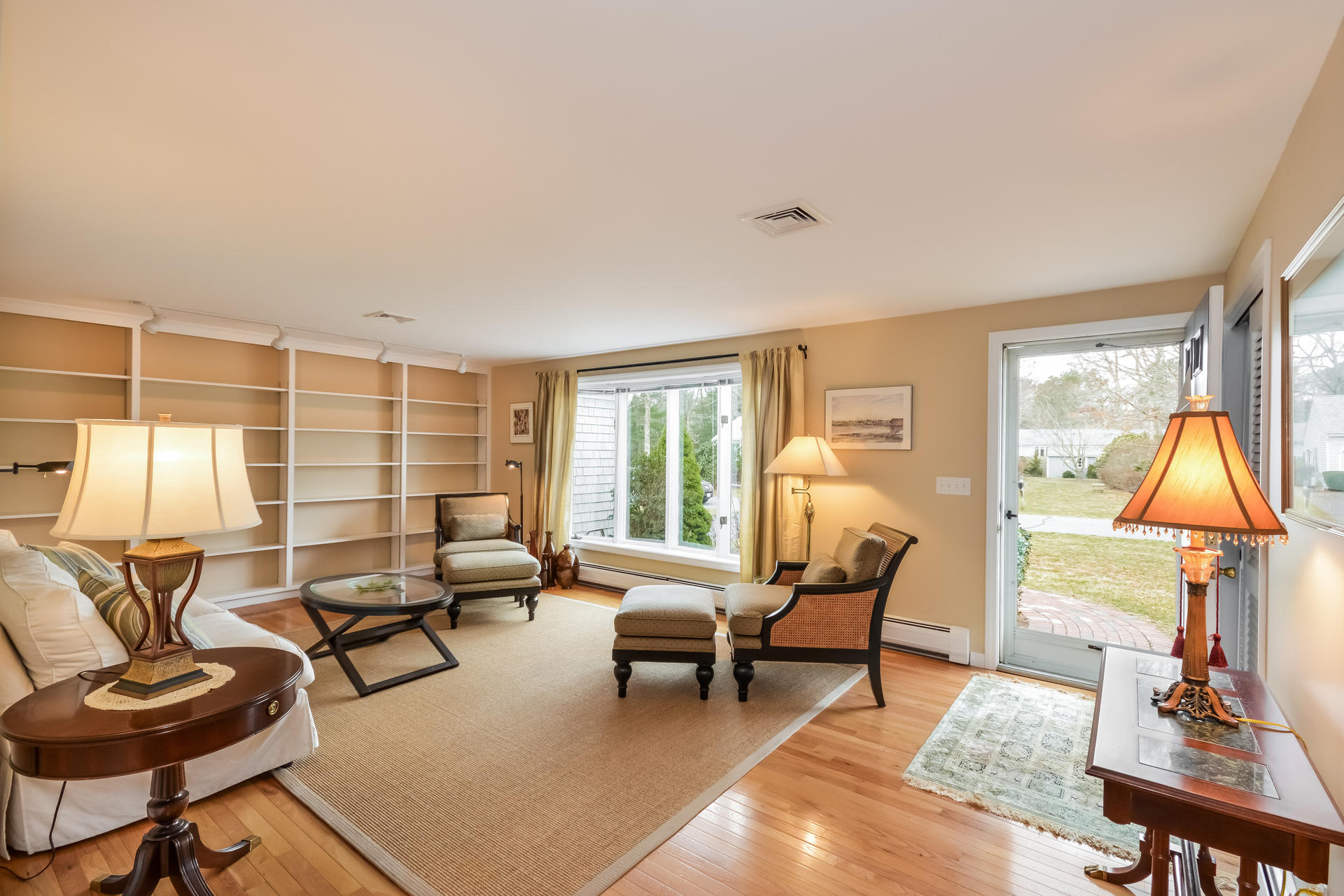 188 Ansel Howland Road Centerville, MA 02632 - Photo 11 of 24 a living room with furniture and a lamp