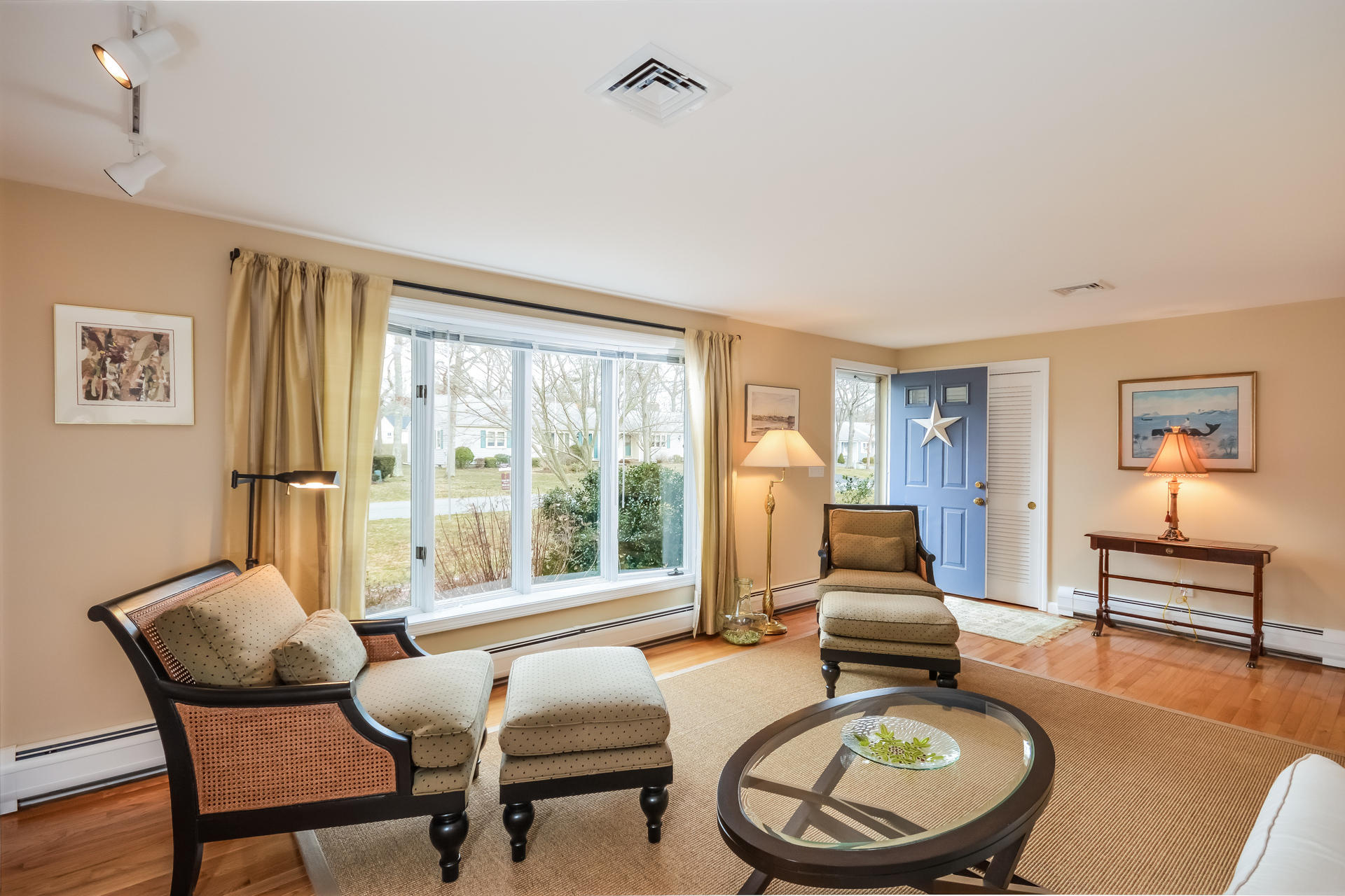188 Ansel Howland Road Centerville, MA 02632 - Photo 12 of 24 a living room with furniture and a floor to ceiling window