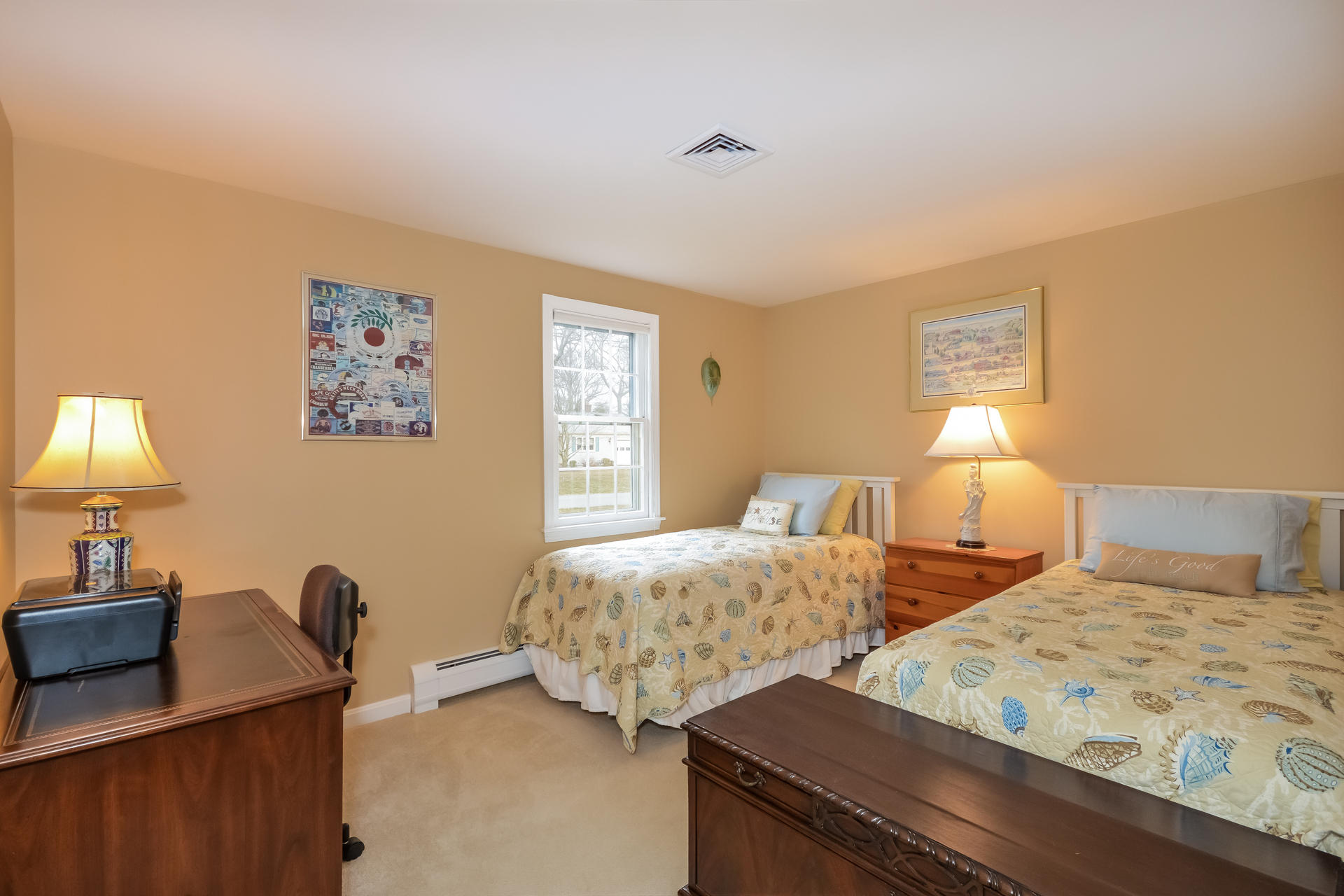 188 Ansel Howland Road Centerville, MA 02632 - Photo 16 of 24 a bedroom with two beds and a lamp on dresser