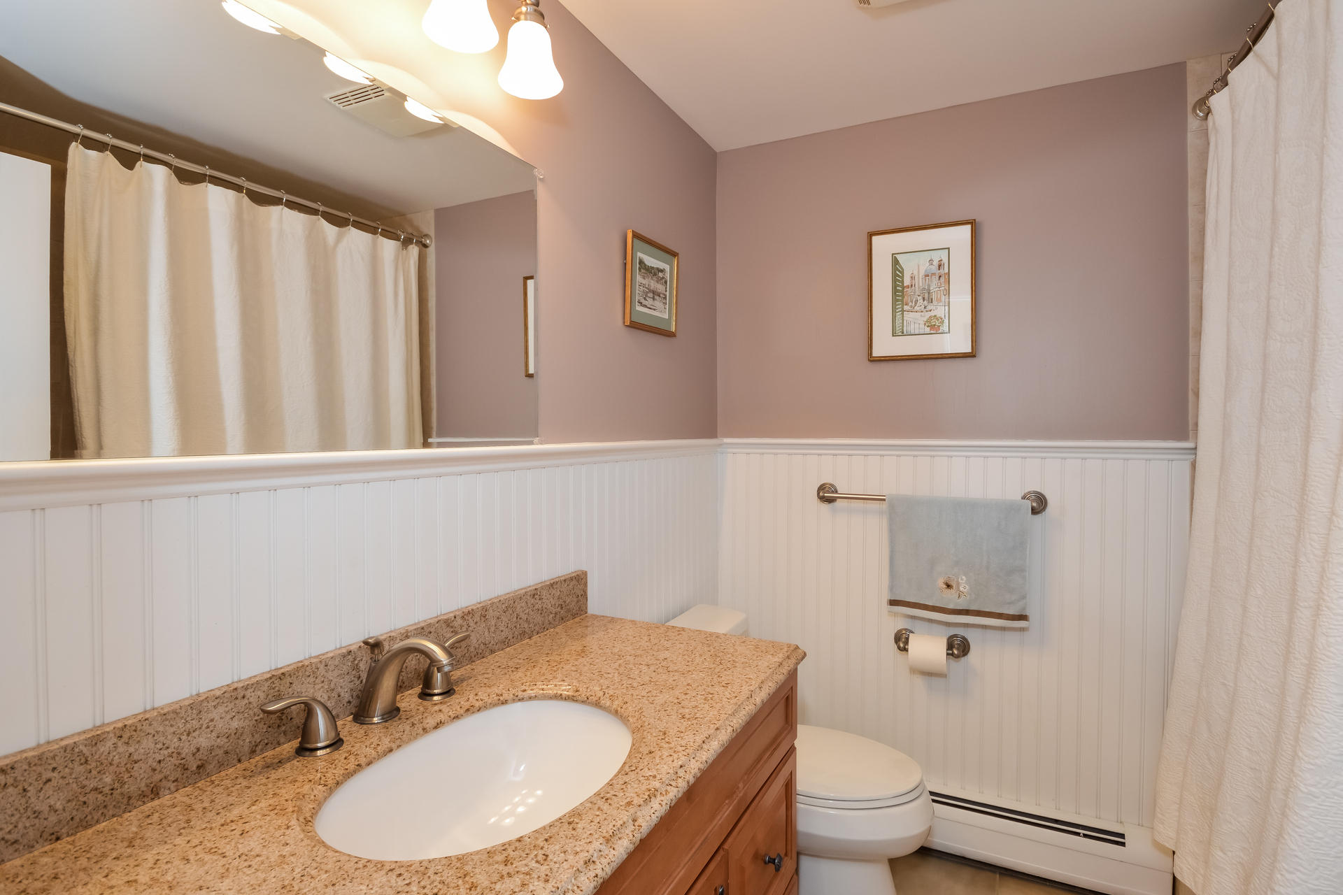 188 Ansel Howland Road Centerville, MA 02632 - Photo 18 of 24 a bathroom with a granite countertop sink and a mirror