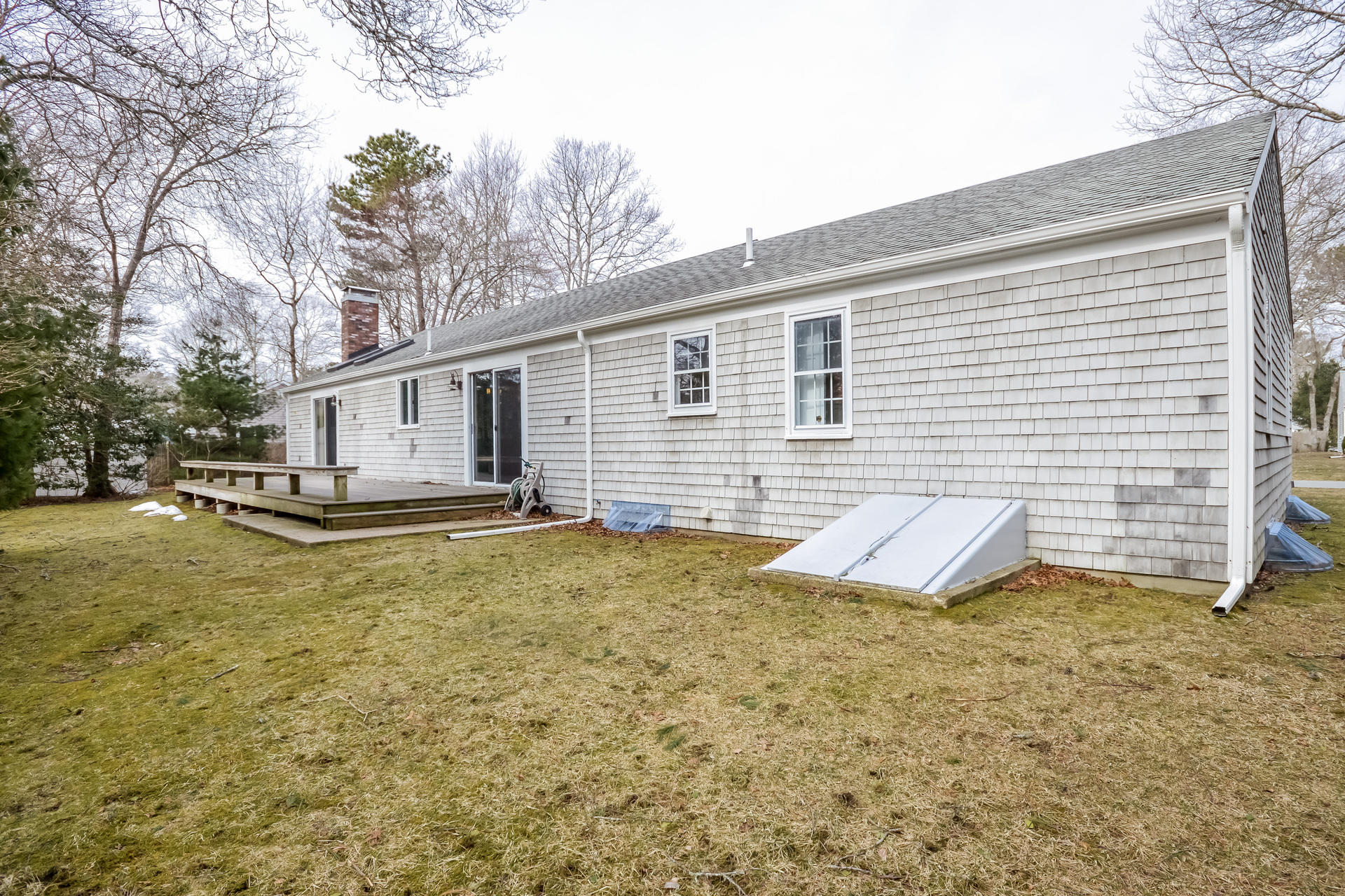 188 Ansel Howland Road Centerville, MA 02632 - Photo 20 of 24 a view of a house with backyard and trees