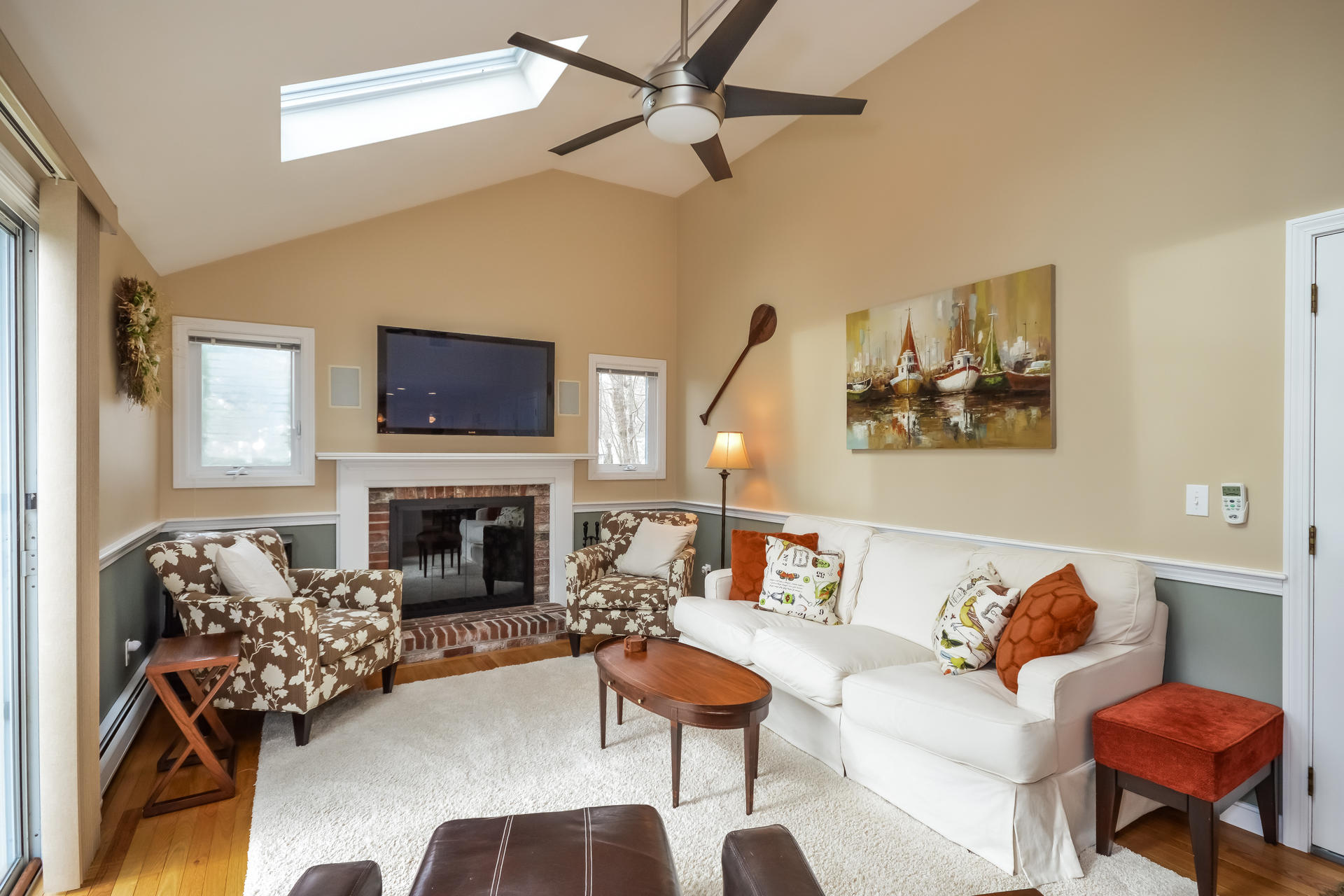 188 Ansel Howland Road Centerville, MA 02632 - Photo 5 of 24 a living room with furniture fireplace and a flat screen tv