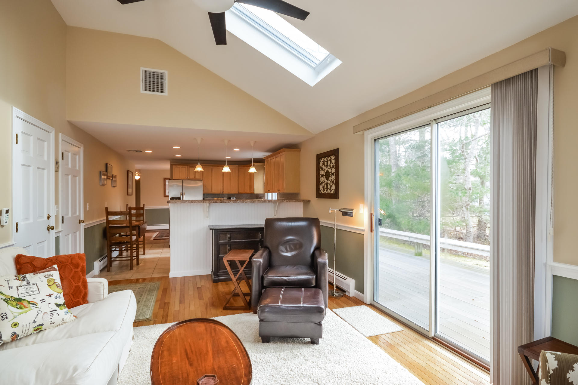 188 Ansel Howland Road Centerville, MA 02632 - Photo 6 of 24 a living room with furniture and a fireplace
