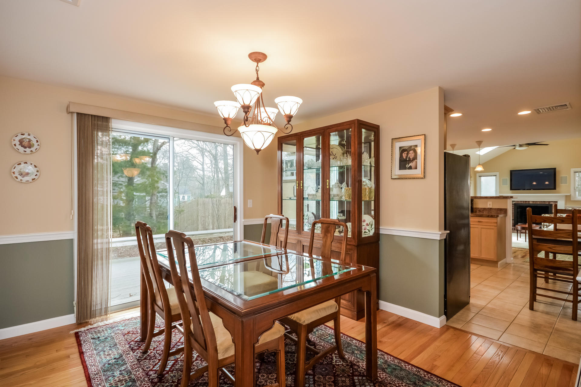 188 Ansel Howland Road Centerville, MA 02632 - Photo 8 of 24 a view of a dining room with furniture wooden floor and chandelier