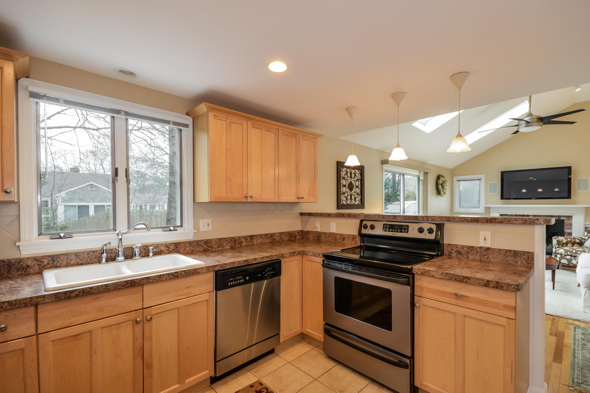 188 Ansel Howland Road Centerville, MA 02632 - Photo 10 of 24 a kitchen with a sink stove top oven and cabinets