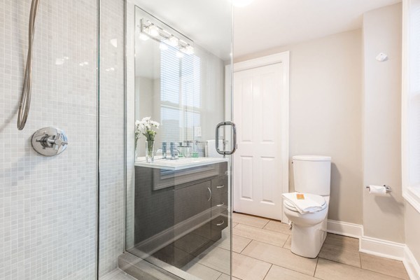 80 Rutland Street, Unit 3 Boston, MA 02118 - Photo 6 of 26 a bathroom with a granite countertop sink a toilet and a mirror