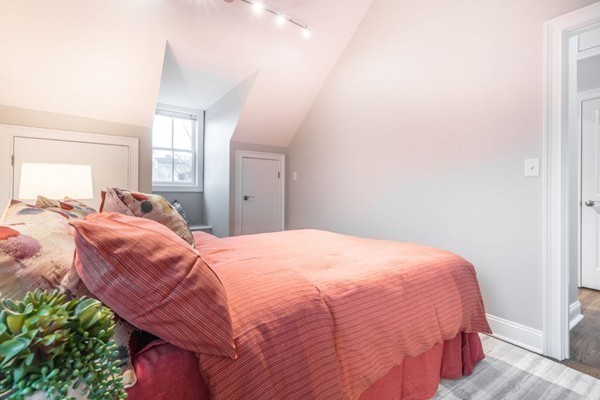 80 Rutland Street, Unit 3 Boston, MA 02118 - Photo 10 of 26 a bed room with a bed and a chair