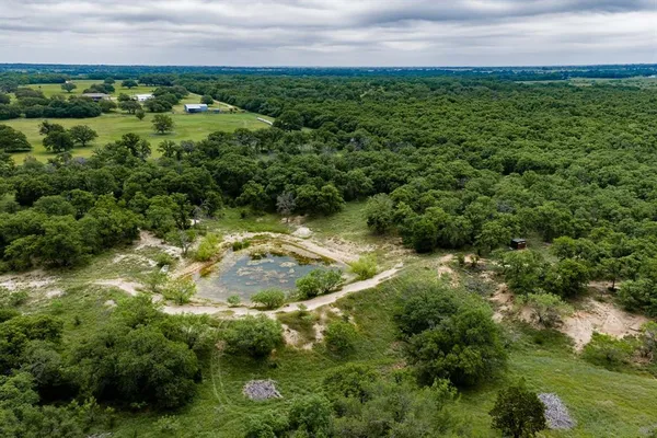 a view of a lake with a yard