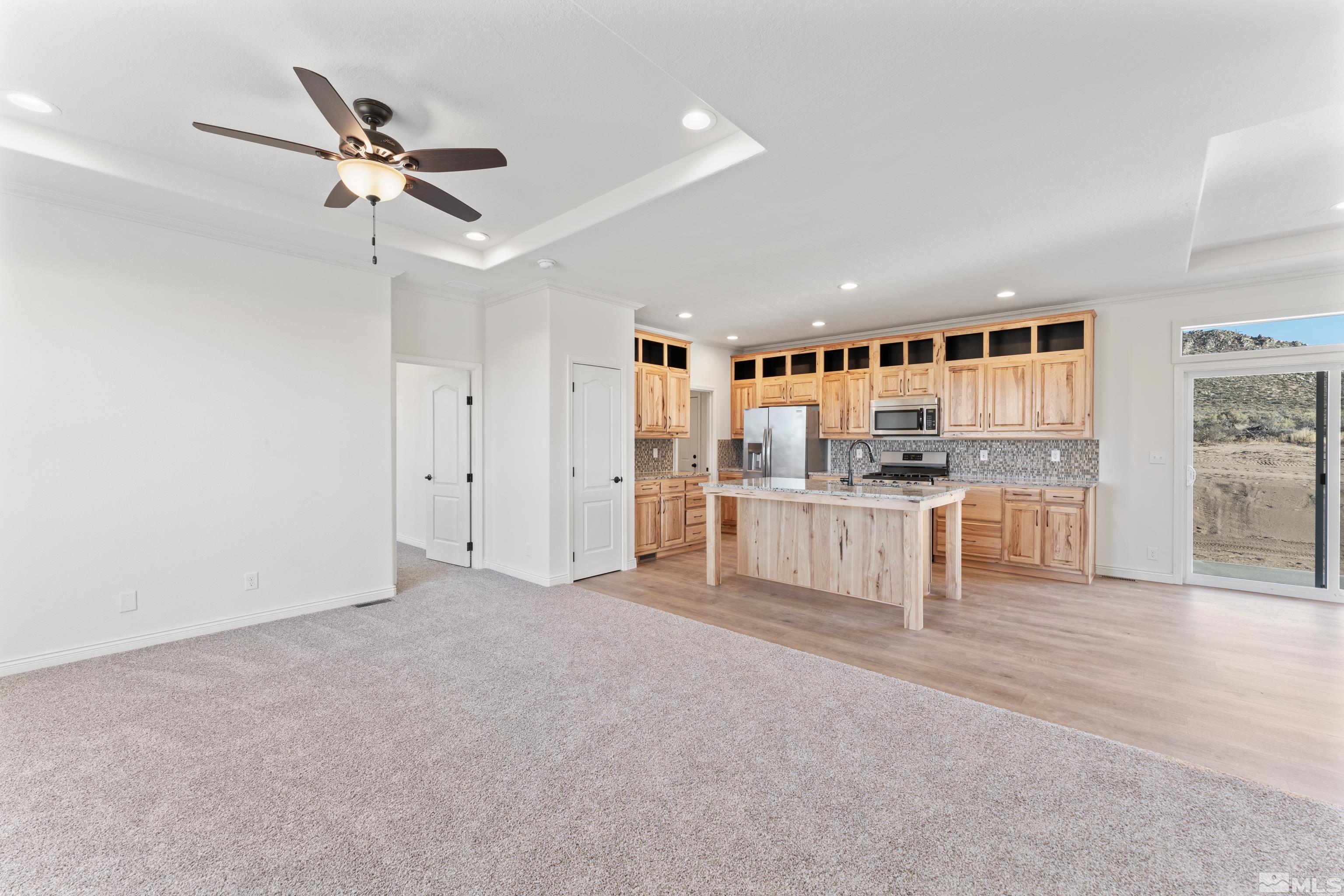 90 Horseshoe Circle Reno, NV 89508 - Photo 12 of 40 a view of a livingroom with kitchen and staircase