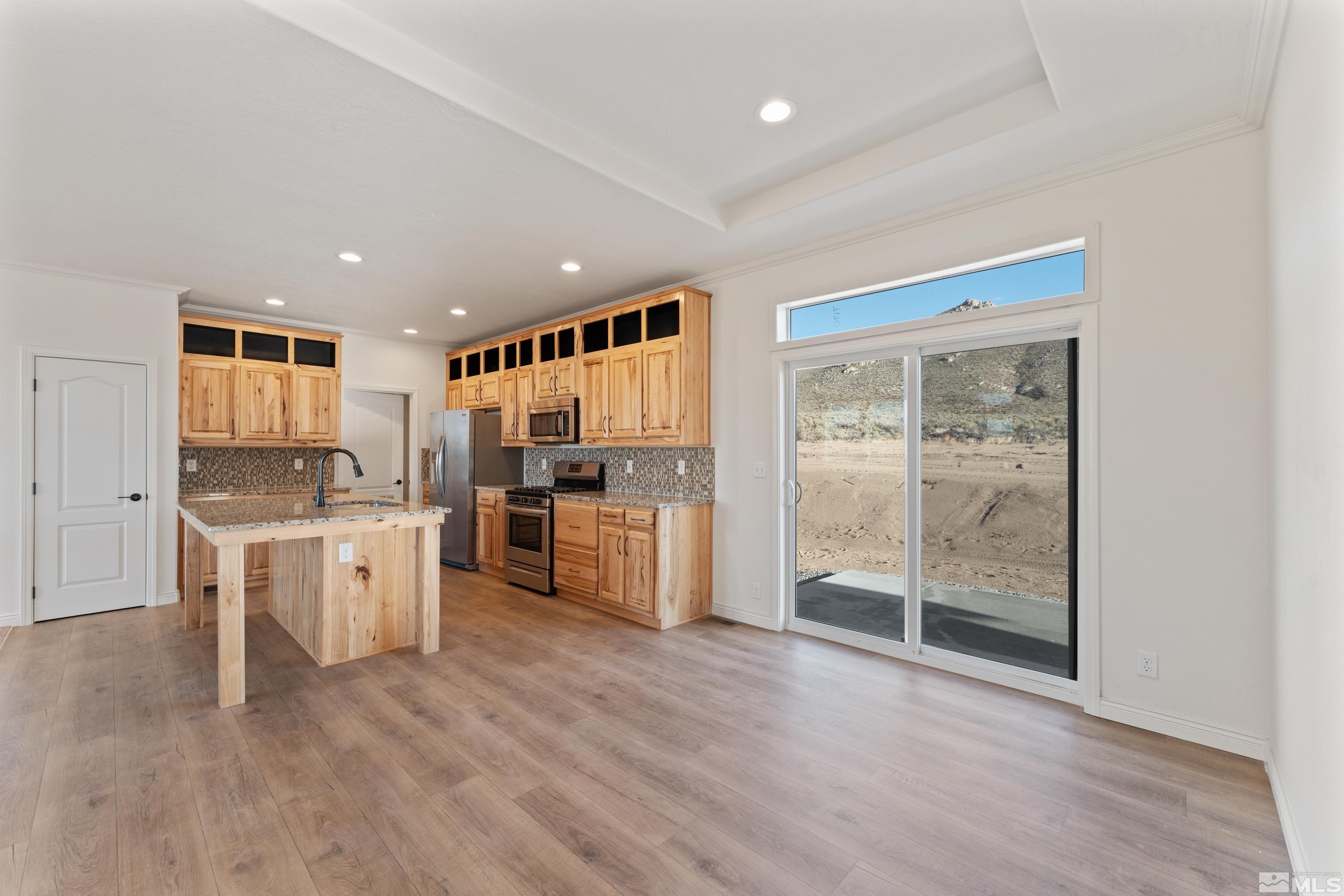 90 Horseshoe Circle Reno, NV 89508 - Photo 14 of 40 a kitchen with a white wooden cabinets and white appliances