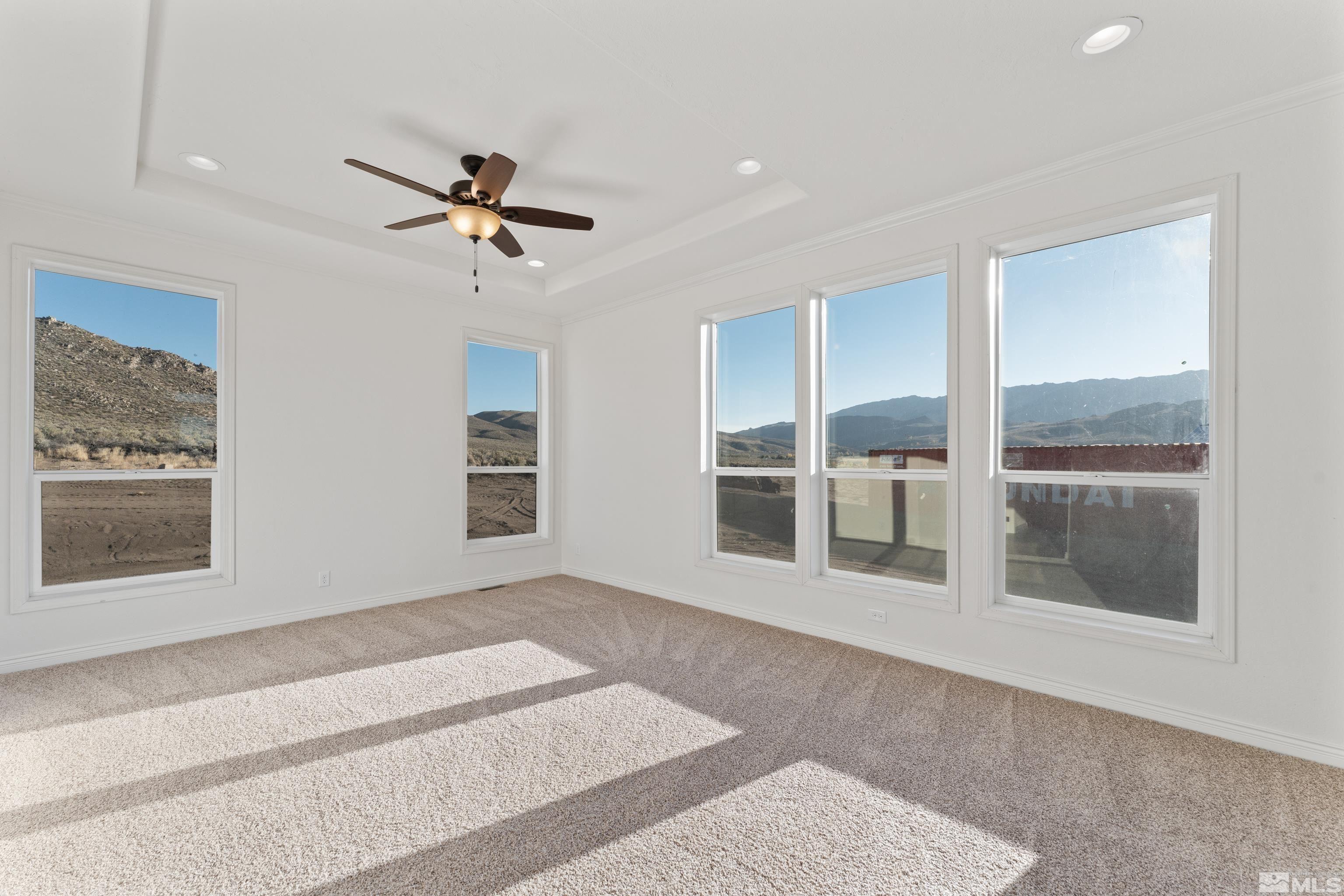 90 Horseshoe Circle Reno, NV 89508 - Photo 19 of 40 a view of a livingroom with a ceiling fan and window