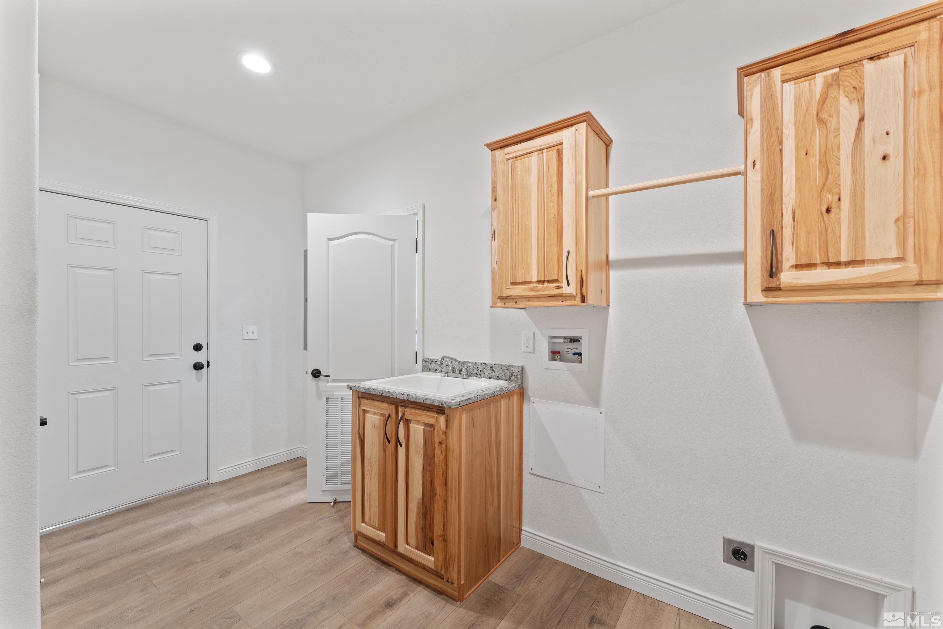 90 Horseshoe Circle Reno, NV 89508 - Photo 33 of 40 a view of a hallway with wooden floor and cabinet