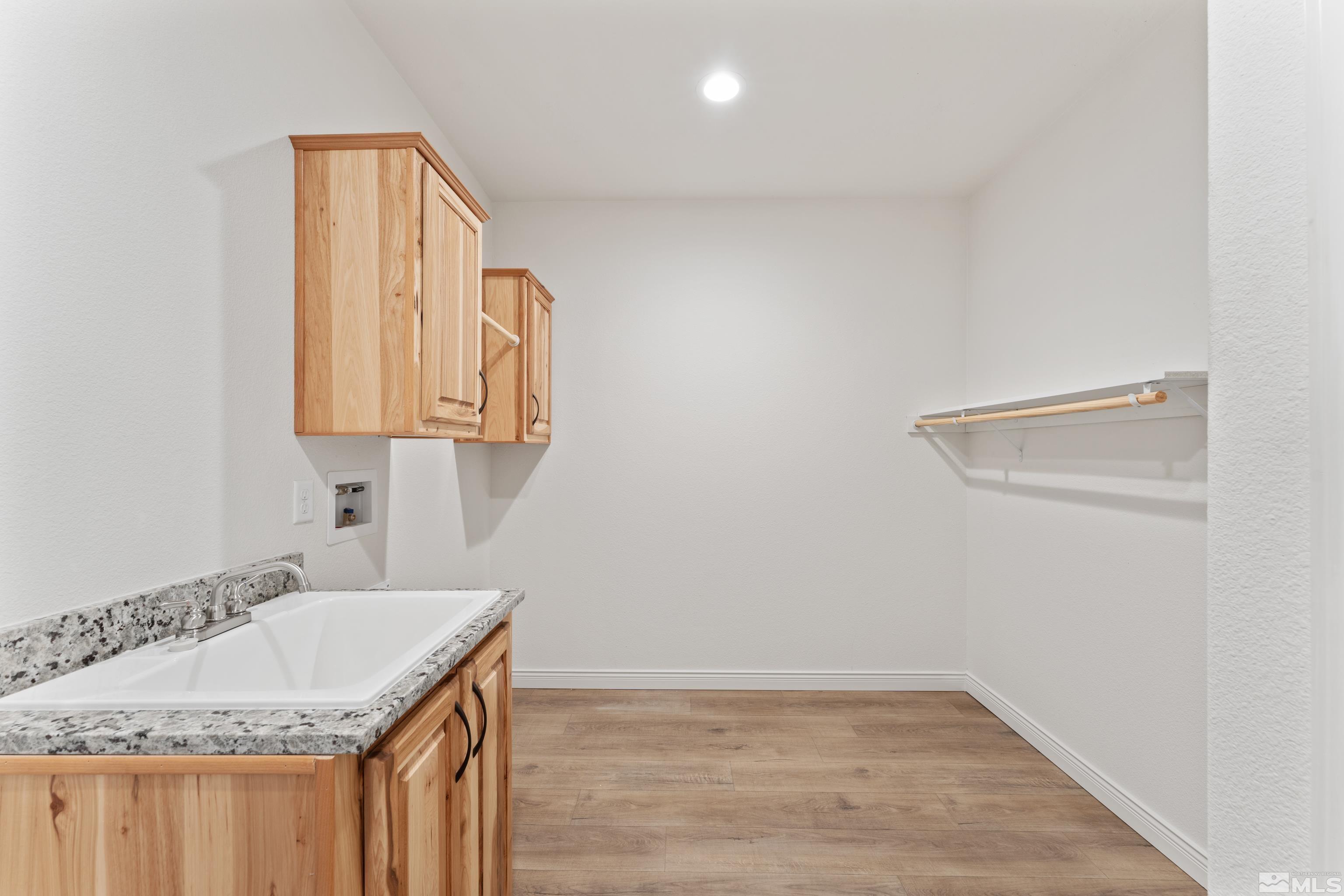90 Horseshoe Circle Reno, NV 89508 - Photo 34 of 40 a bathroom with a granite countertop sink and a mirror