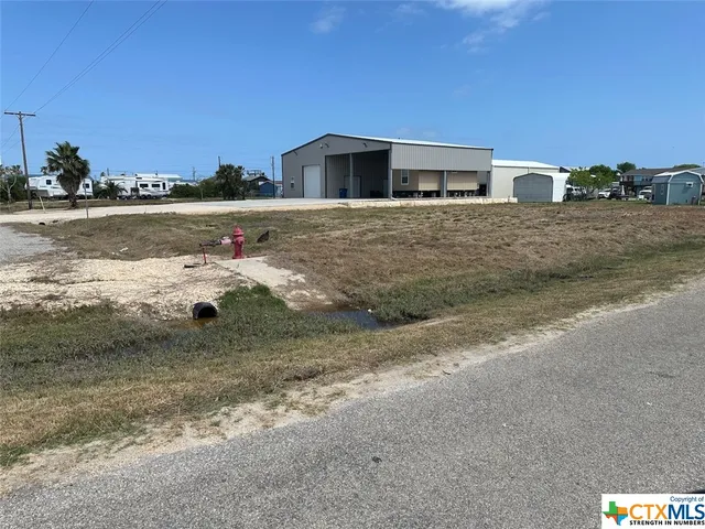 a view of a lake with a building in the background