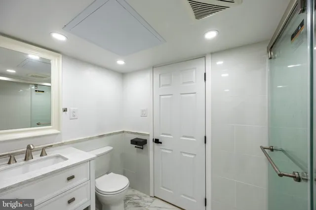 an empty room with wooden floor and closet