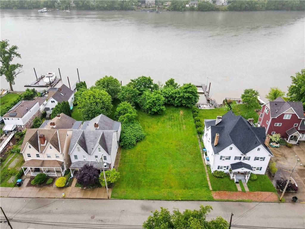 536 Penn Street Verona, PA 15147 - Photo 4 of 18 an aerial view of residential house with outdoor space and lake view