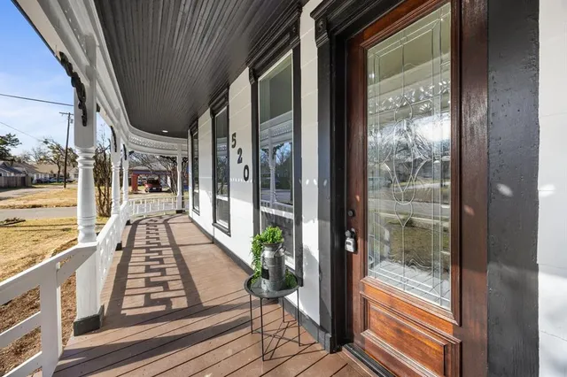 a view of a balcony with wooden floor