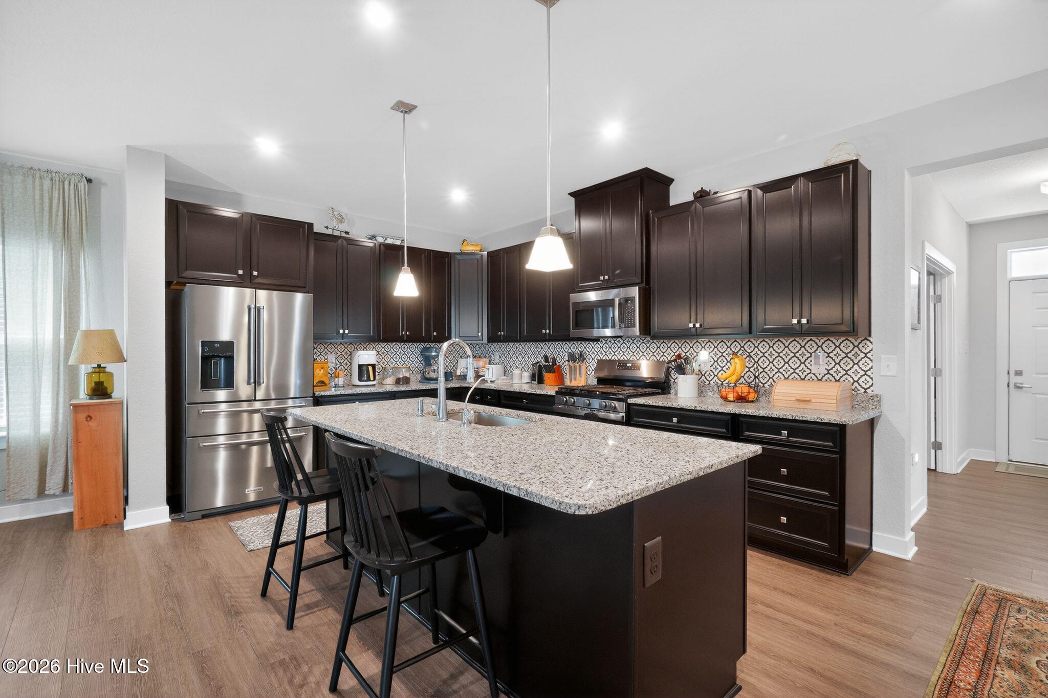 406 Ryker Road East Moyock, NC 27958 - Photo 2 of 35 Luxury vinyl plank (LVP) flooring.