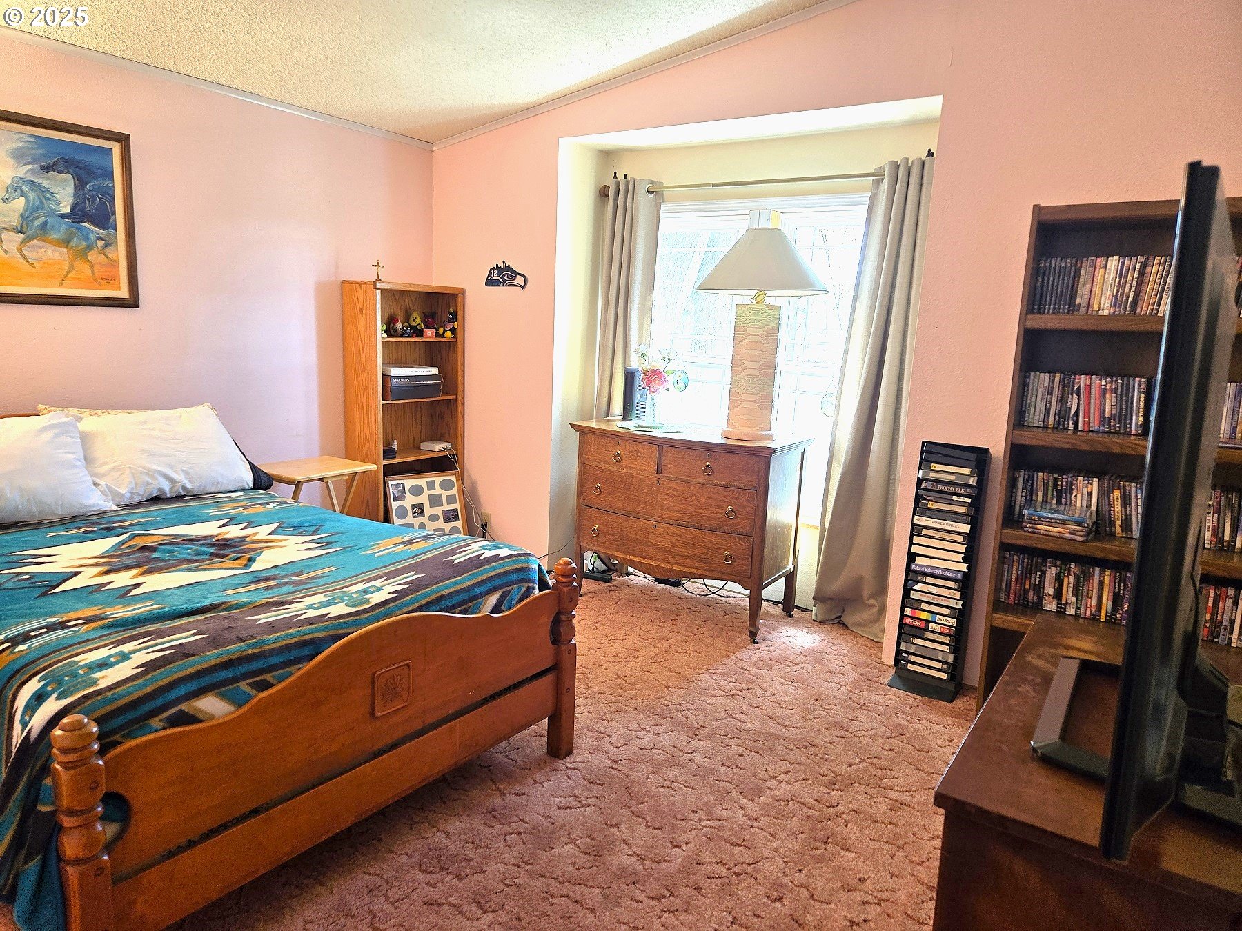 401 Main Street Unity, OR 97884 - Photo 11 of 46 a bedroom with a bed and a bookshelf