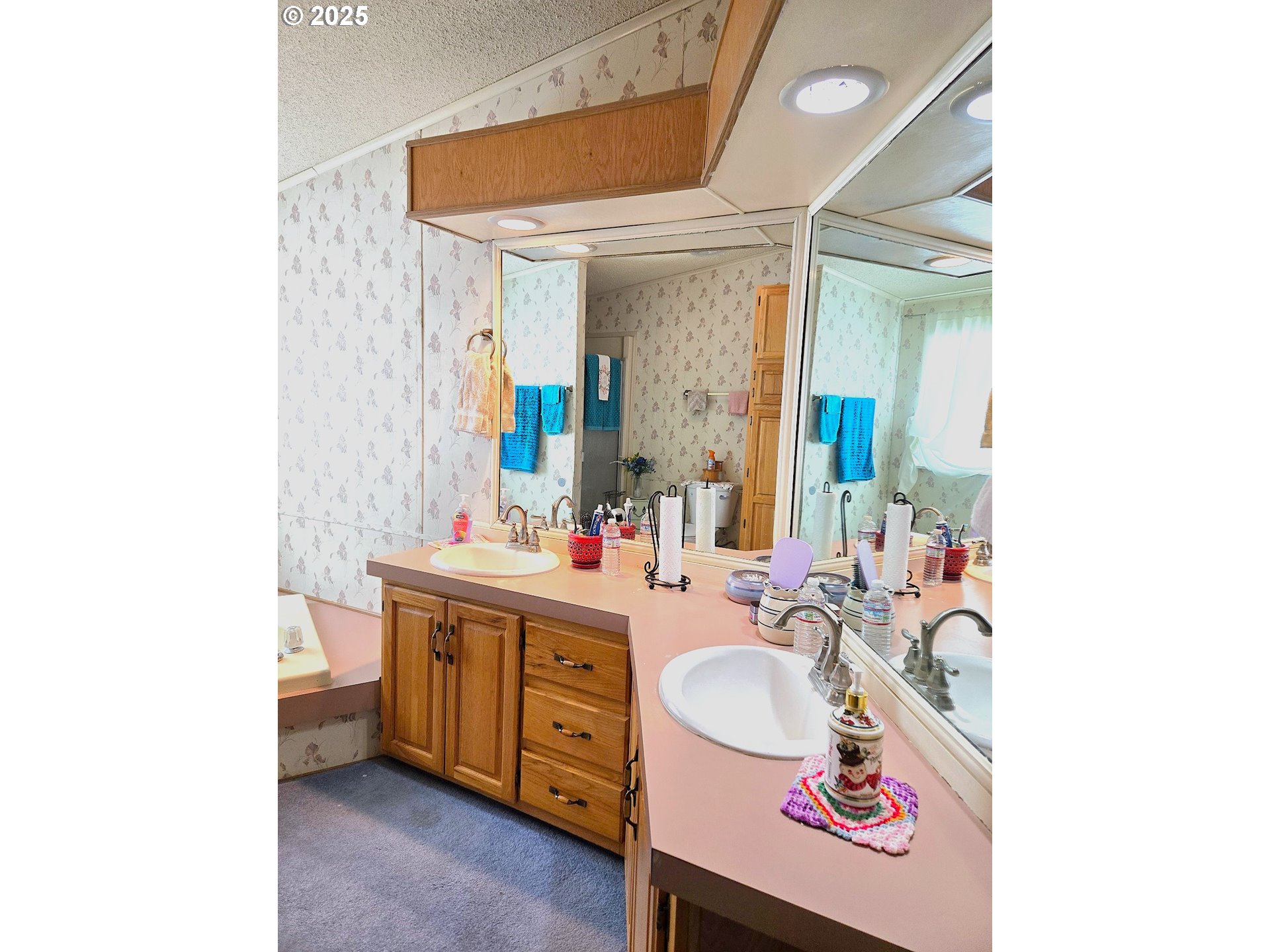 401 Main Street Unity, OR 97884 - Photo 14 of 46 a bathroom with a sink a vanity and a mirror