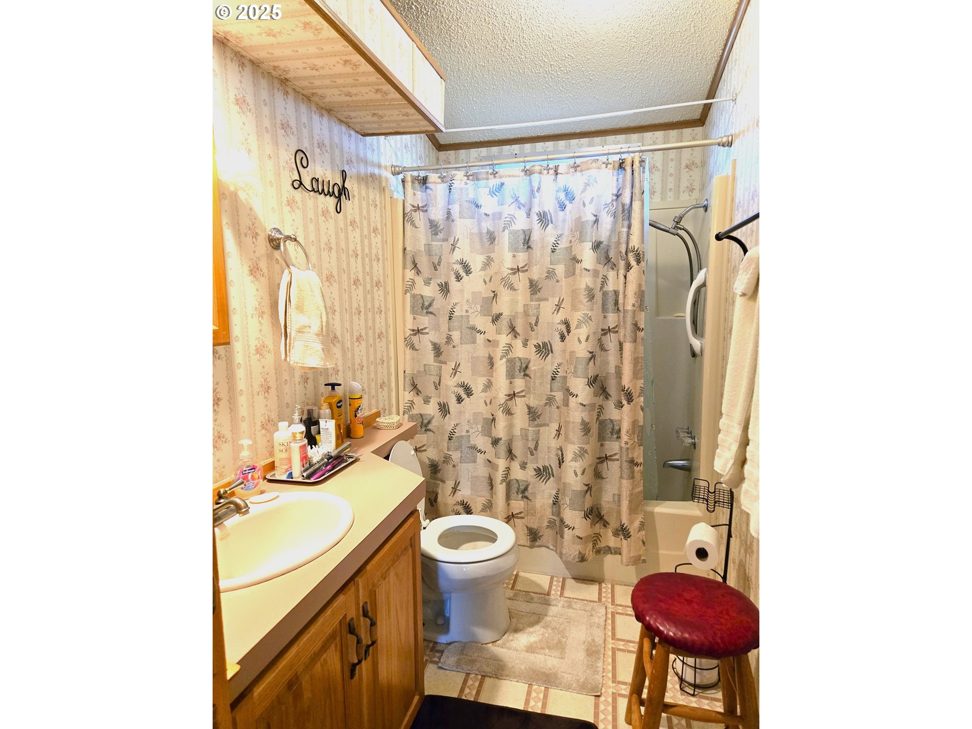 401 Main Street Unity, OR 97884 - Photo 15 of 46 a bathroom with a sink a toilet and shower curtain