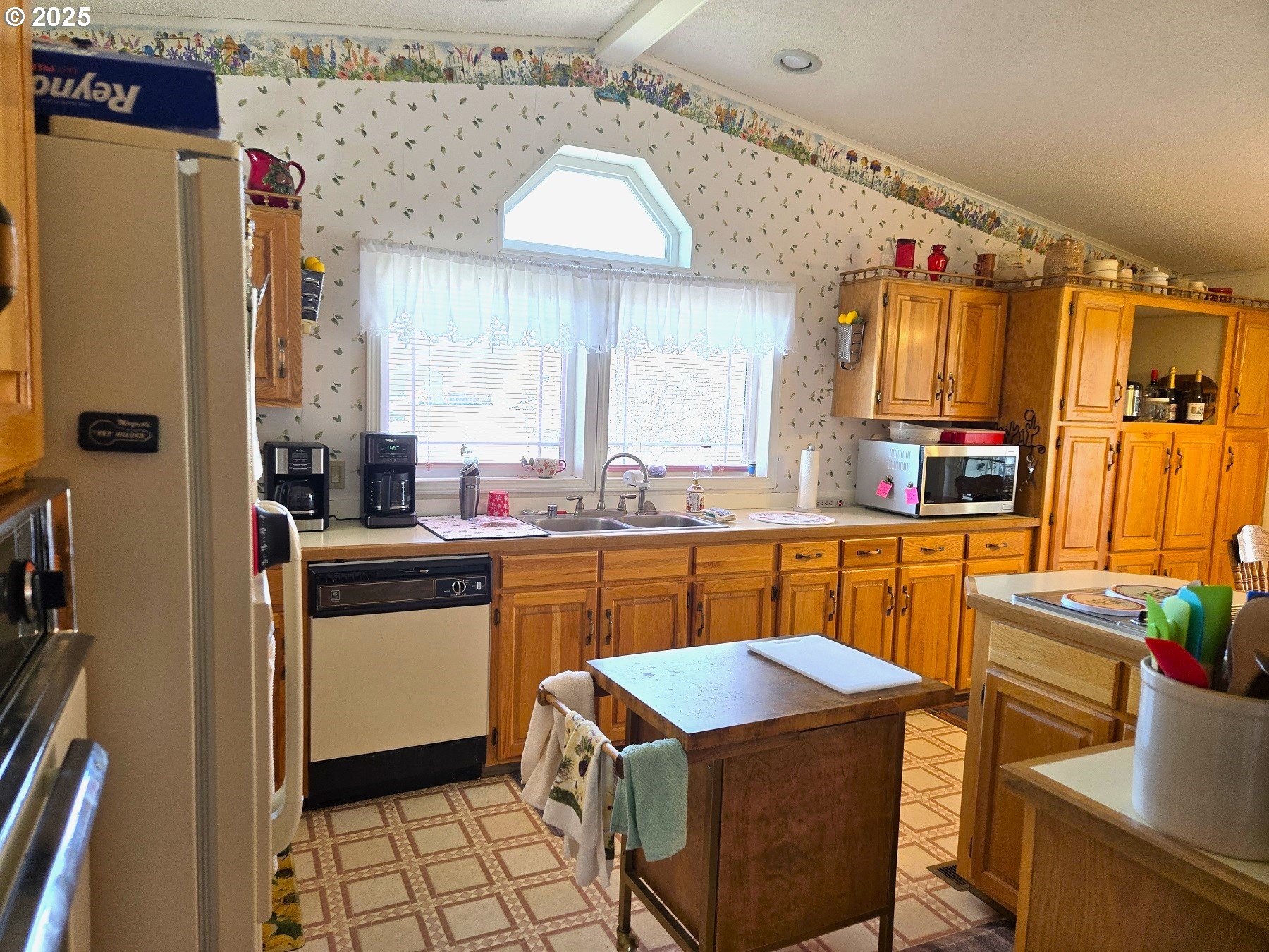 401 Main Street Unity, OR 97884 - Photo 6 of 46 a kitchen with stainless steel appliances a stove a sink dishwasher and a refrigerator