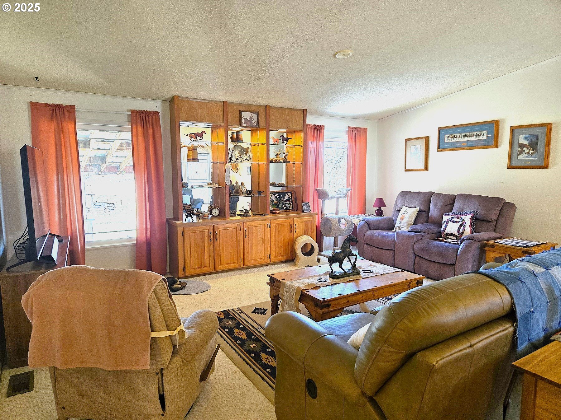 401 Main Street Unity, OR 97884 - Photo 9 of 46 a living room with furniture and a large window