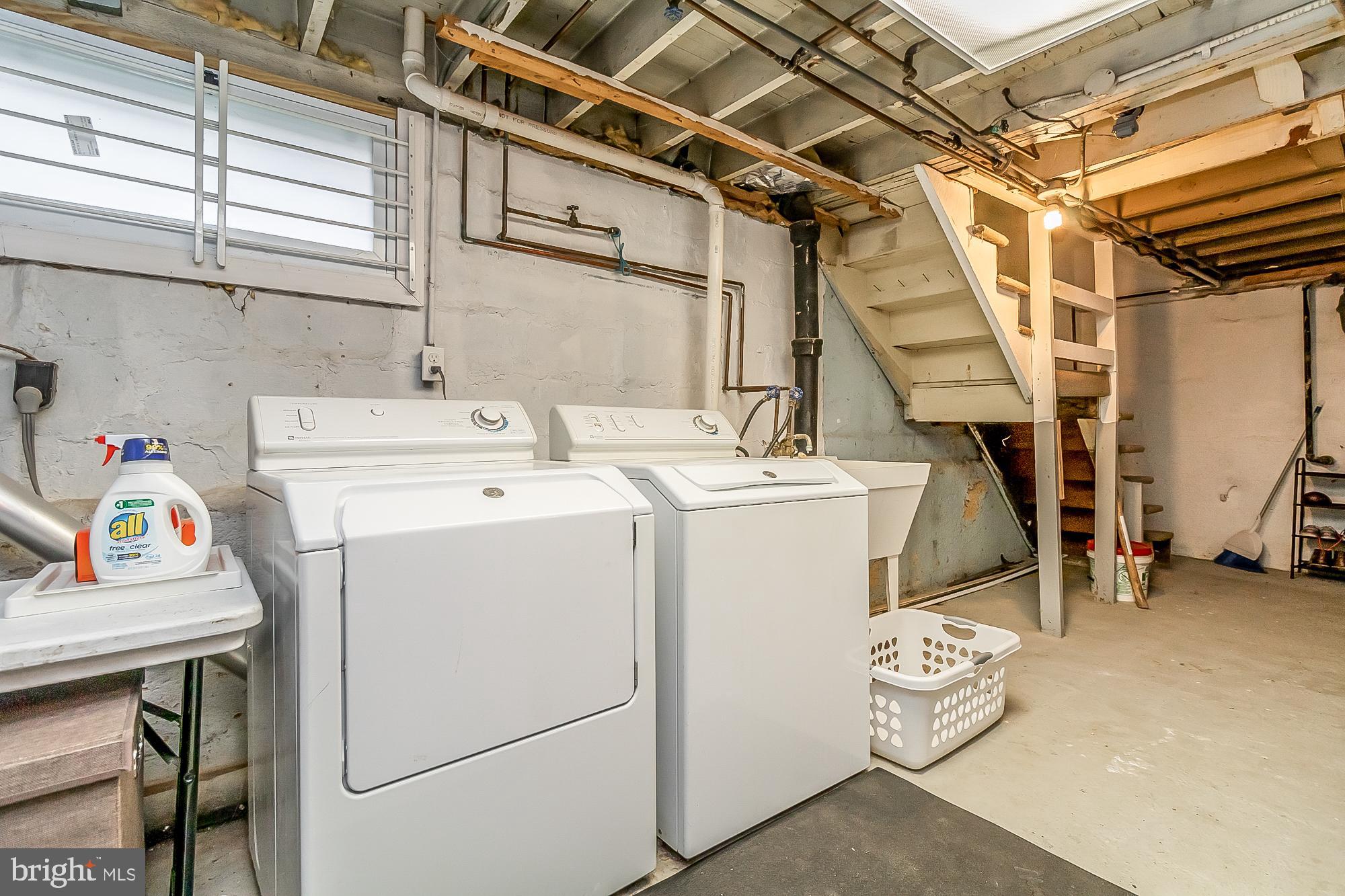 714 Hollen Road Baltimore, MD 21212 - Photo 30 of 36 Unifinished basement with washer and dryer